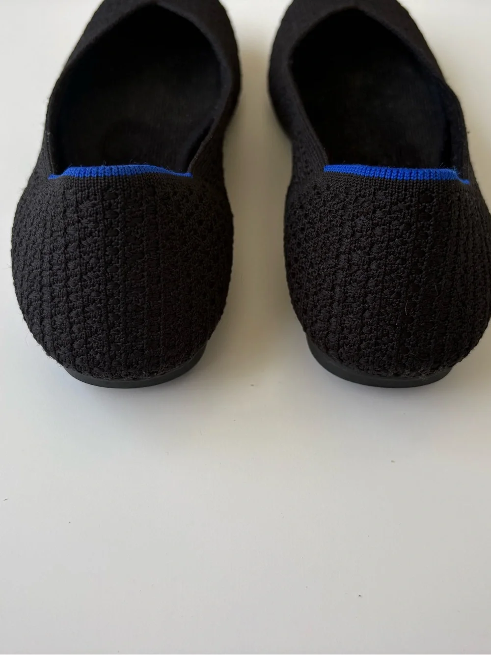 Rothy's Black Knit Ballet Flats with Blue Heel Trim. Womens size 7.5